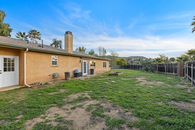 view of yard featuring a fenced backyard