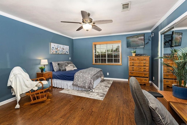 bedroom with visible vents, ornamental molding, and wood finished floors