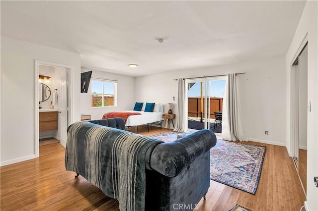 living room with light wood finished floors and baseboards