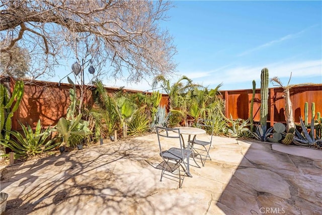 view of patio / terrace featuring fence