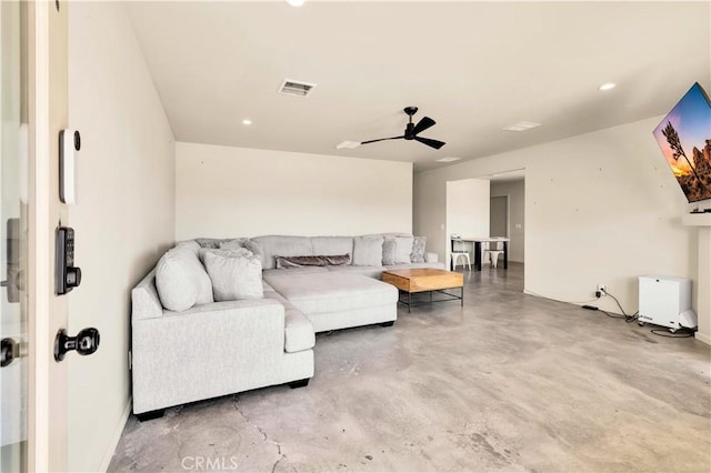 living area with finished concrete floors, recessed lighting, visible vents, and a ceiling fan