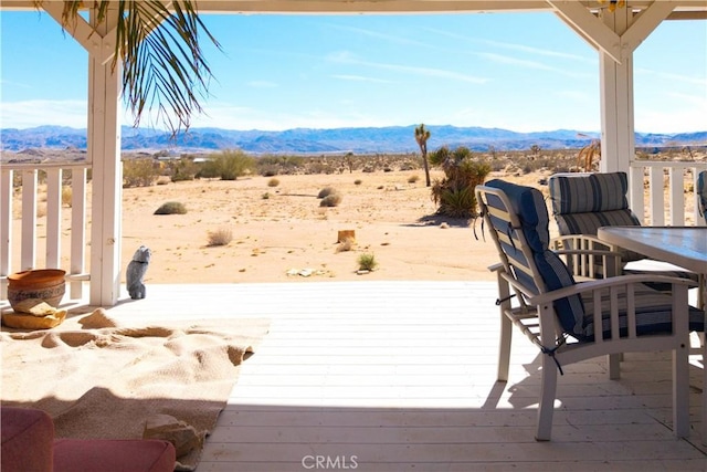 wooden terrace featuring a mountain view