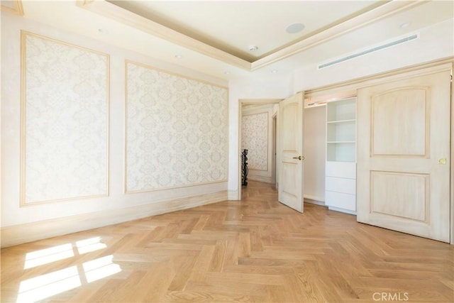 unfurnished bedroom with baseboards and visible vents