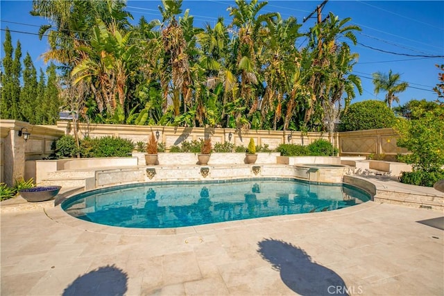 view of pool with a fenced in pool, a patio area, fence, and an in ground hot tub