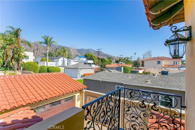 balcony with a residential view and a mountain view