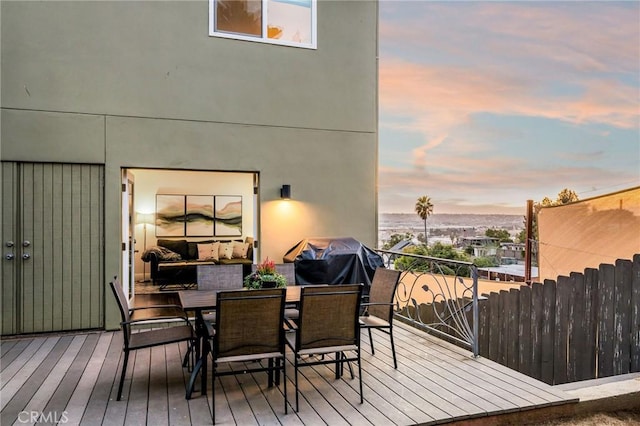 deck with outdoor dining area