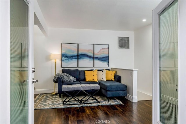 sitting room featuring baseboards, visible vents, wood finished floors, and recessed lighting