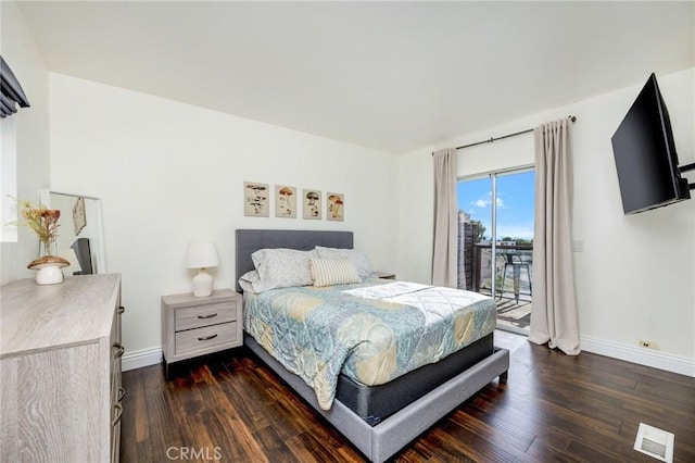 bedroom featuring baseboards, dark wood-type flooring, visible vents, and access to exterior