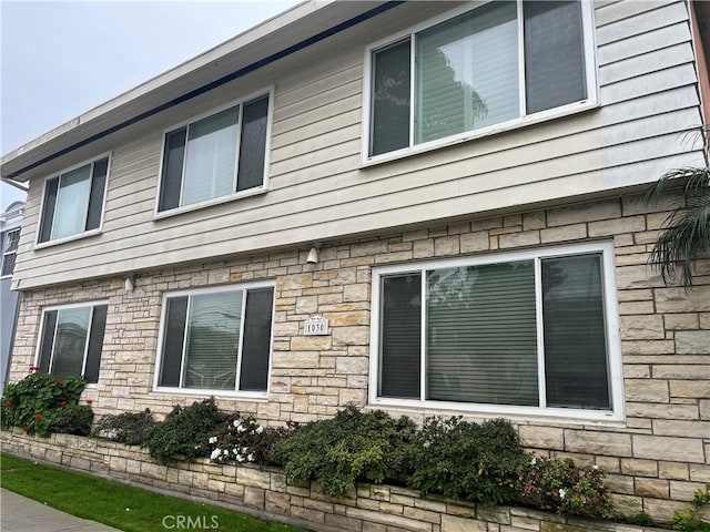 view of home's exterior with stone siding