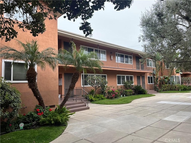 view of front of house featuring stucco siding