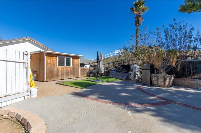 exterior space with driveway and fence