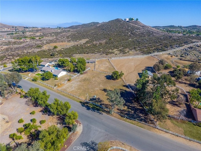 birds eye view of property featuring a mountain view