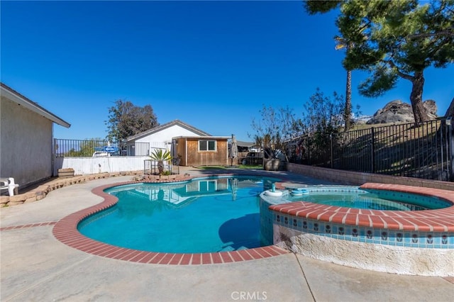 view of swimming pool with a patio area, a fenced backyard, and a pool with connected hot tub