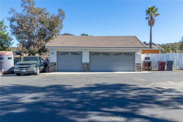 garage featuring fence