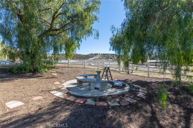 view of yard with fence and a patio