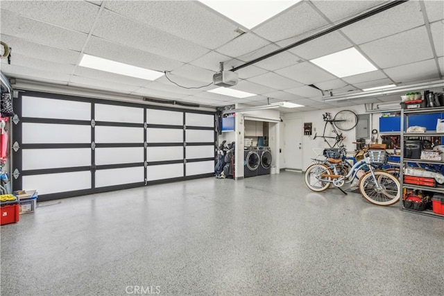 garage featuring a garage door opener and washing machine and dryer