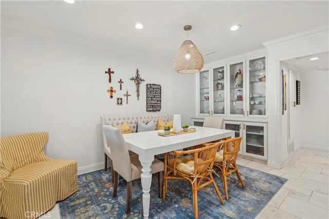 dining space featuring baseboards, recessed lighting, and crown molding