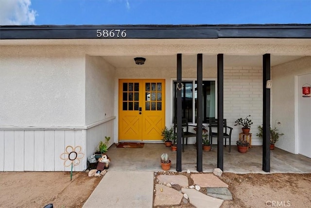 58676 Sunflower Dr, Yucca Valley, CA 92284 - entrance to property featuring brick siding and covered porch