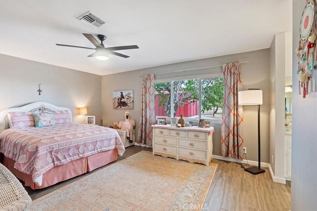 58676 Sunflower Dr, Yucca Valley, CA 92284 - bedroom with wood finished floors, baseboards, and ceiling fan