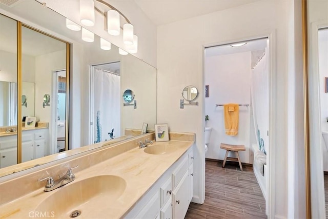 58676 Sunflower Dr, Yucca Valley, CA 92284 - bathroom featuring toilet, double vanity, wood finished floors, and a shower with shower curtain
