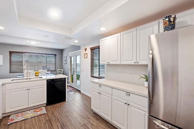 58676 Sunflower Dr, Yucca Valley, CA 92284 - kitchen with freestanding refrigerator, dishwasher, a sink, wood finished floors, and recessed lighting