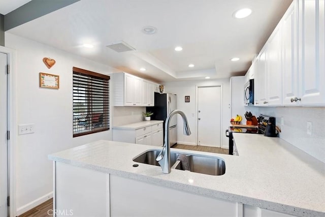 58676 Sunflower Dr, Yucca Valley, CA 92284 - kitchen featuring a sink, appliances with stainless steel finishes, white cabinetry, recessed lighting, and light stone countertops