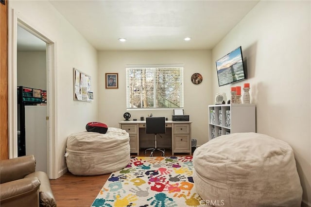 office with recessed lighting and light wood finished floors