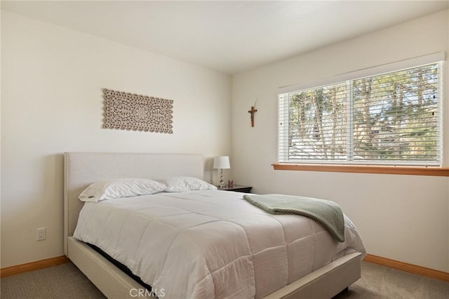 carpeted bedroom with baseboards