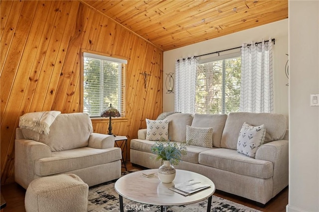 living room with vaulted ceiling, wood walls, wooden ceiling, and wood finished floors