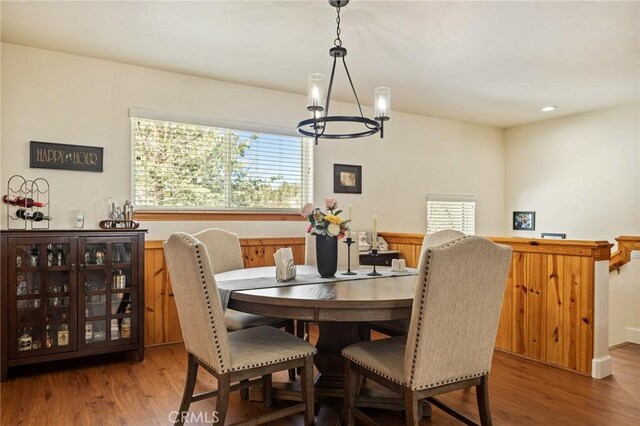 dining room featuring wood finished floors and recessed lighting