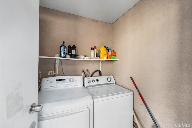 washroom featuring laundry area and independent washer and dryer