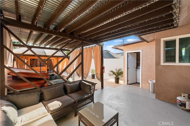 exterior space featuring washer / clothes dryer and outdoor lounge area