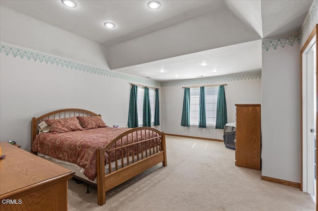 bedroom with baseboards, recessed lighting, lofted ceiling, and light colored carpet