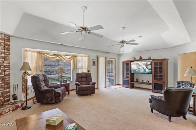 living area featuring carpet floors, a raised ceiling, vaulted ceiling, and baseboards