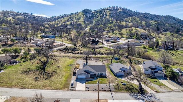 drone / aerial view featuring a residential view and a mountain view