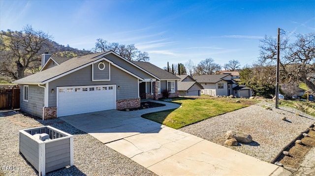 view of front of house featuring an attached garage, brick siding, fence, driveway, and a chimney