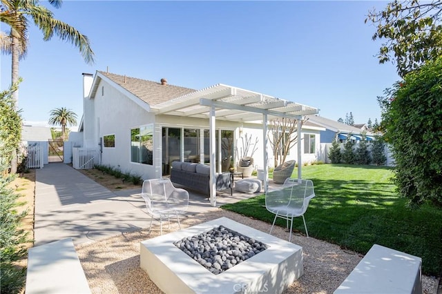 back of property featuring an outdoor living space with a fire pit, a patio, stucco siding, a lawn, and a gate