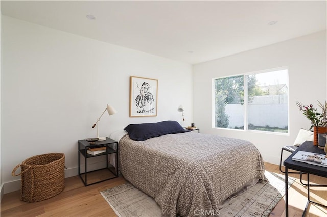 bedroom with light wood-style floors