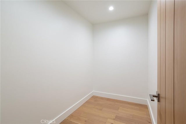 interior space featuring light wood-type flooring, baseboards, and recessed lighting