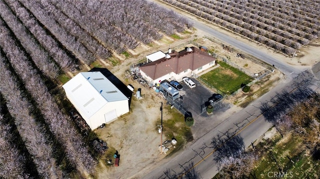 birds eye view of property with a rural view