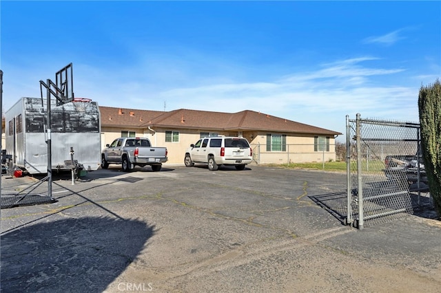 uncovered parking lot with fence