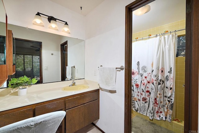 bathroom with a stall shower and vanity