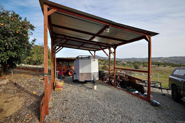 view of parking featuring a carport