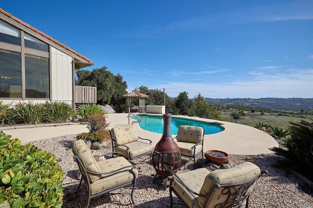 outdoor pool with a patio area