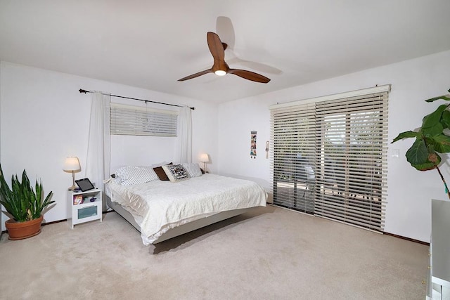 bedroom with a ceiling fan, carpet, and baseboards