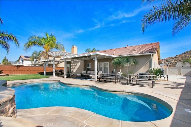 view of swimming pool with fence, a gate, a fenced in pool, a pergola, and a patio area