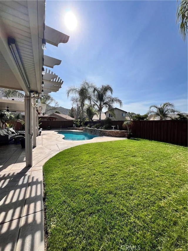 view of yard featuring a patio, a fenced backyard, a fenced in pool, and a pergola