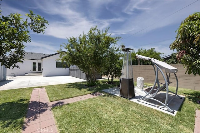 view of yard with a patio area and a fenced backyard