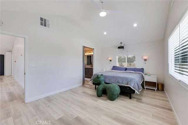 bedroom featuring light wood-style floors, visible vents, and baseboards