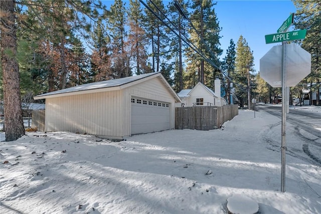 detached garage with fence